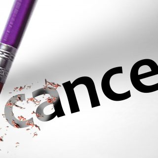 Eraser deleting the word Cancer